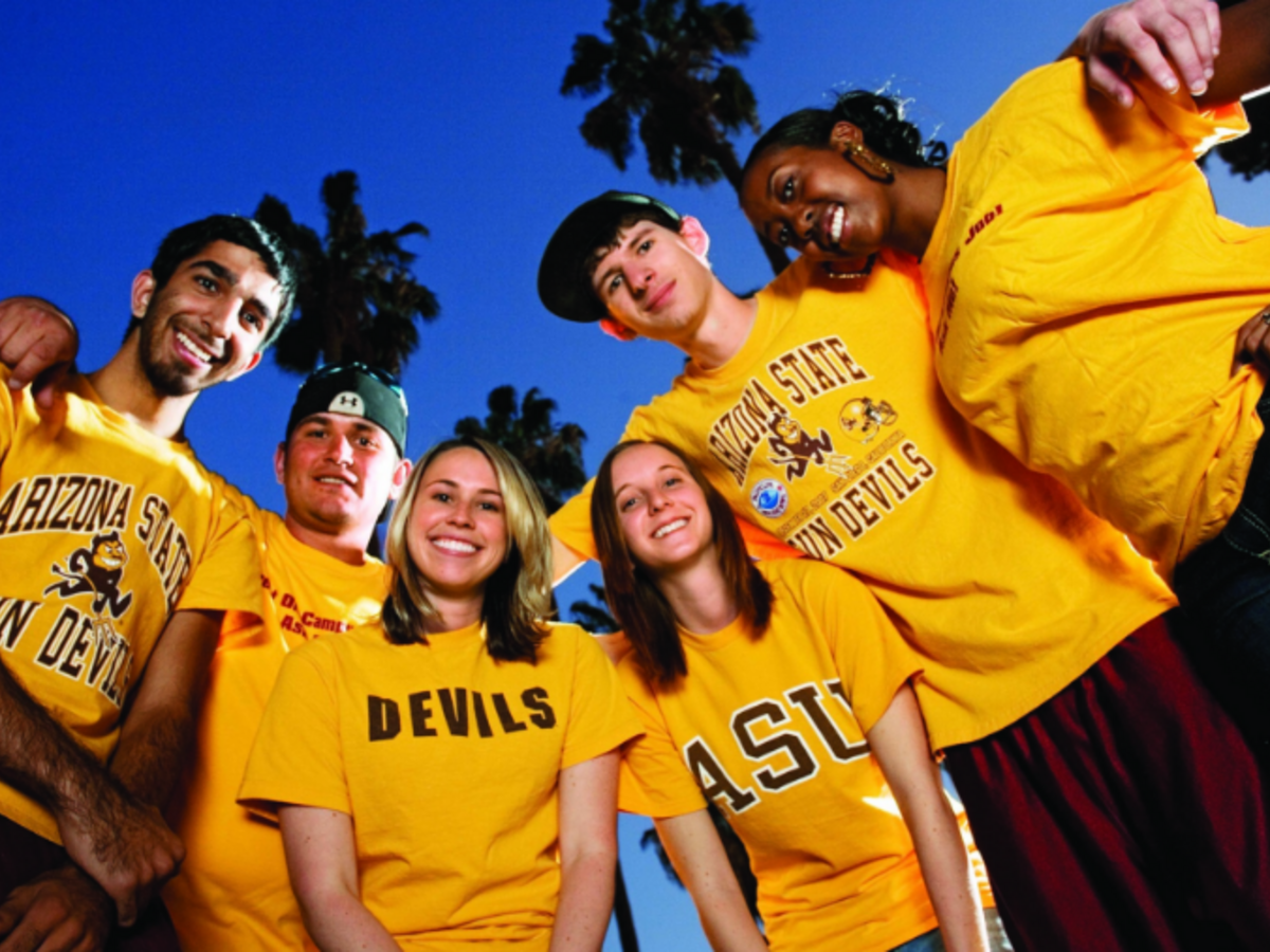 Students in a circle wearing ASU gold shirts