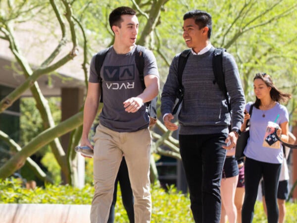 Students walking on Palm Walk